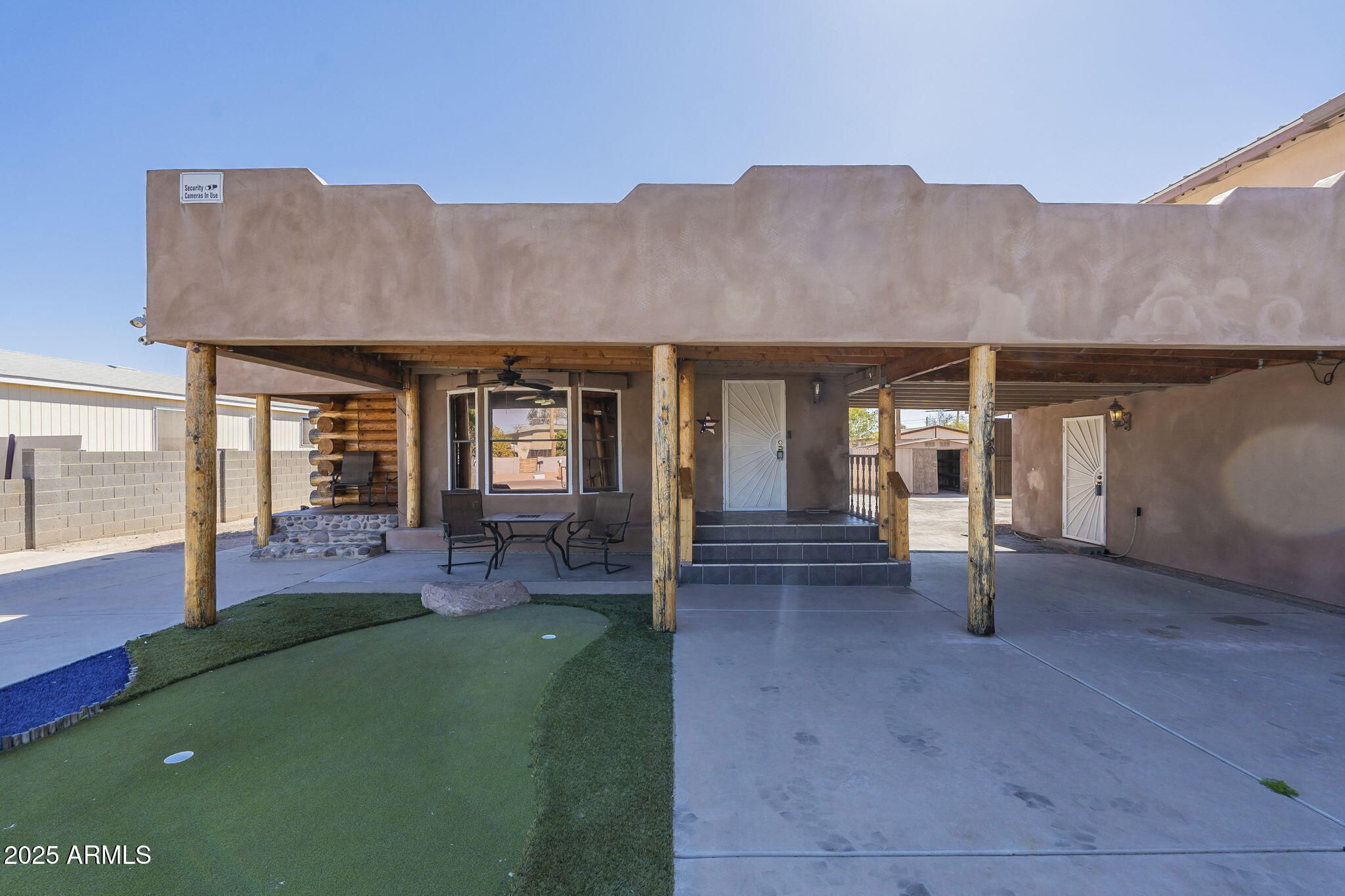 1373 East 23rd Avenue Apache Junction, AZ 85119 - Photo 4 of 53 a view of an house with backyard porch and furniture