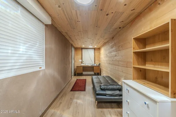 a view of a room with wooden floor
