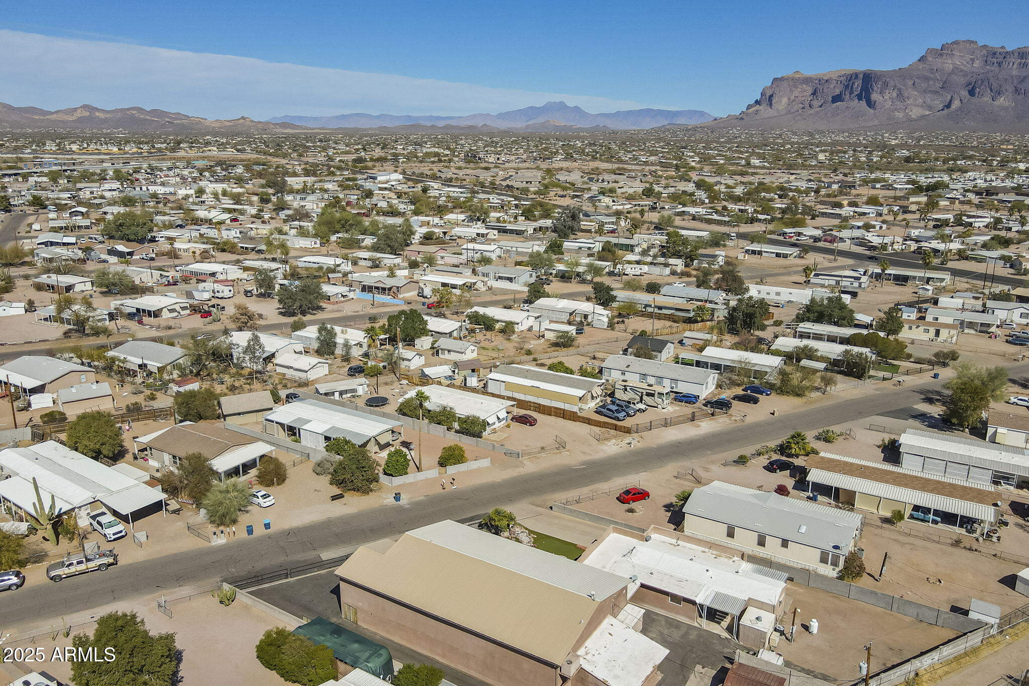 1373 East 23rd Avenue Apache Junction, AZ 85119 - Photo 52 of 53 an aerial view of residential building and parking space