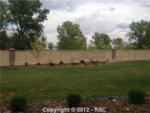 10735 Rhinestone Drive Colorado Springs, CO 80908 - Photo 14 of 16 Back yard borders open space with lots of trees and hiking/riding trails