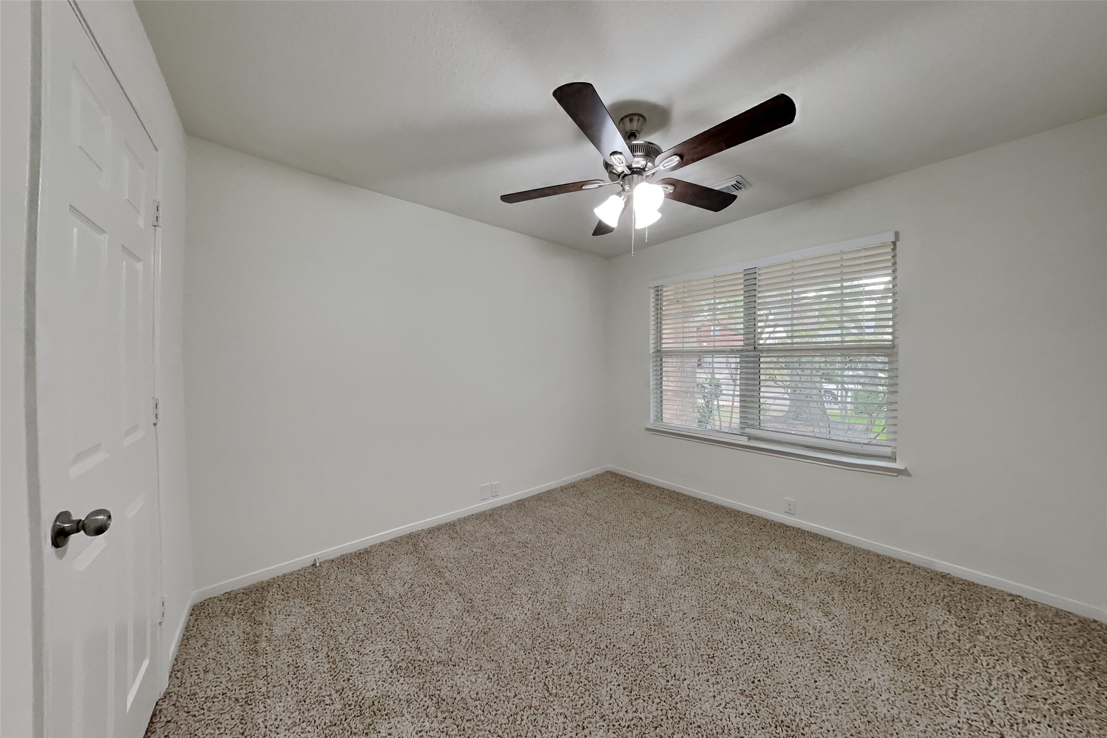 10414 Falling River Drive Houston, TX 77095 - Photo 10 of 18 a view of an empty room with a window
