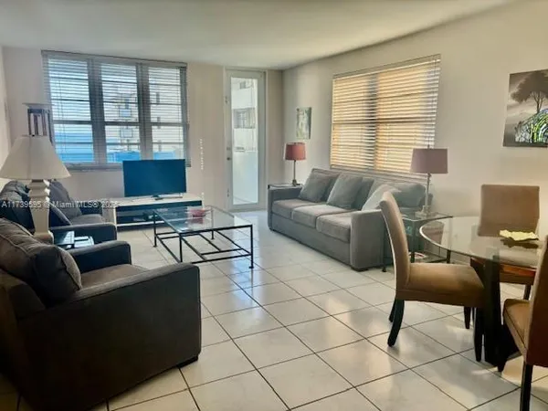 a living room with furniture and a window