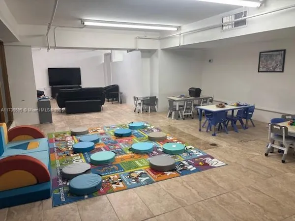a room with furniture and a rug
