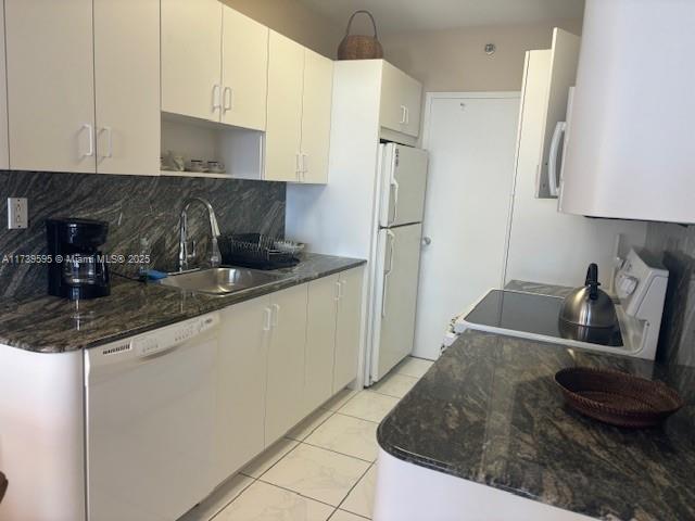 100 Lincoln Road, Unit 821 Miami Beach, FL 33139 - Photo 4 of 30 a kitchen with stainless steel appliances granite countertop a sink a stove and a refrigerator