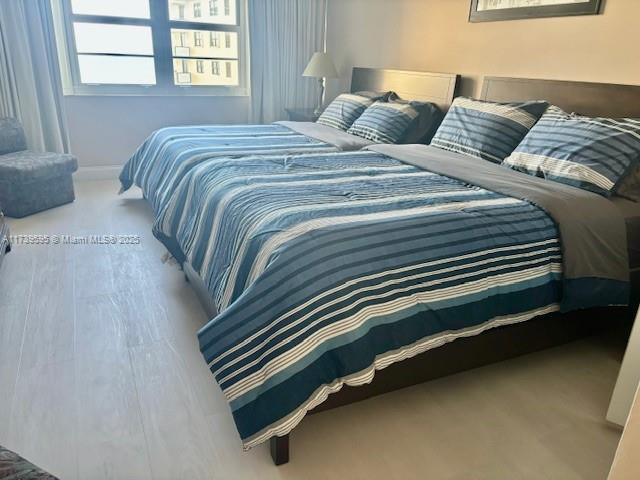 100 Lincoln Road, Unit 821 Miami Beach, FL 33139 - Photo 5 of 30 a bedroom with a bed and windows