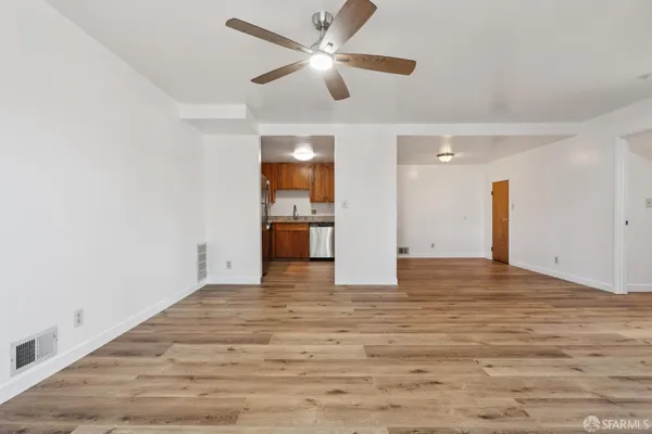 a kitchen with stainless steel appliances granite countertop a refrigerator sink and cabinets