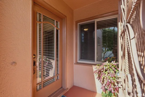 a view of a door and a window