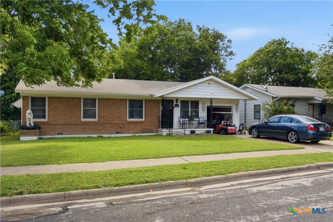 503 Cardinal Avenue Killeen, TX 76541 - Photo 2 of 26 a front view of a house with a garden
