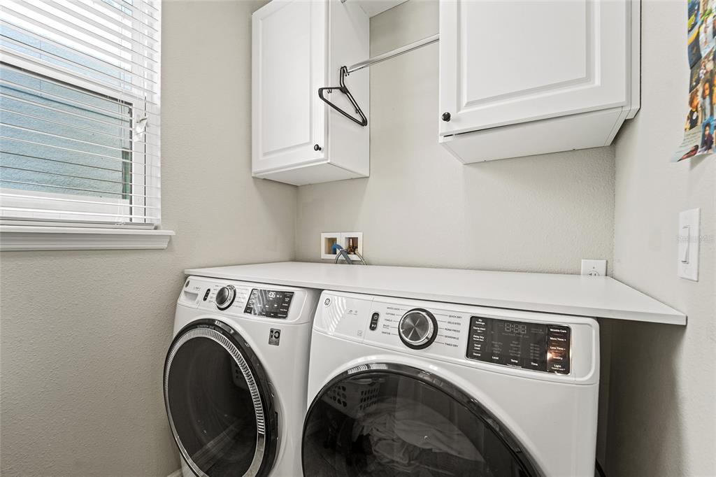 8903 Arabella Lane Seminole, FL 33777 - Photo 18 of 47 a utility room with dryer and washer
