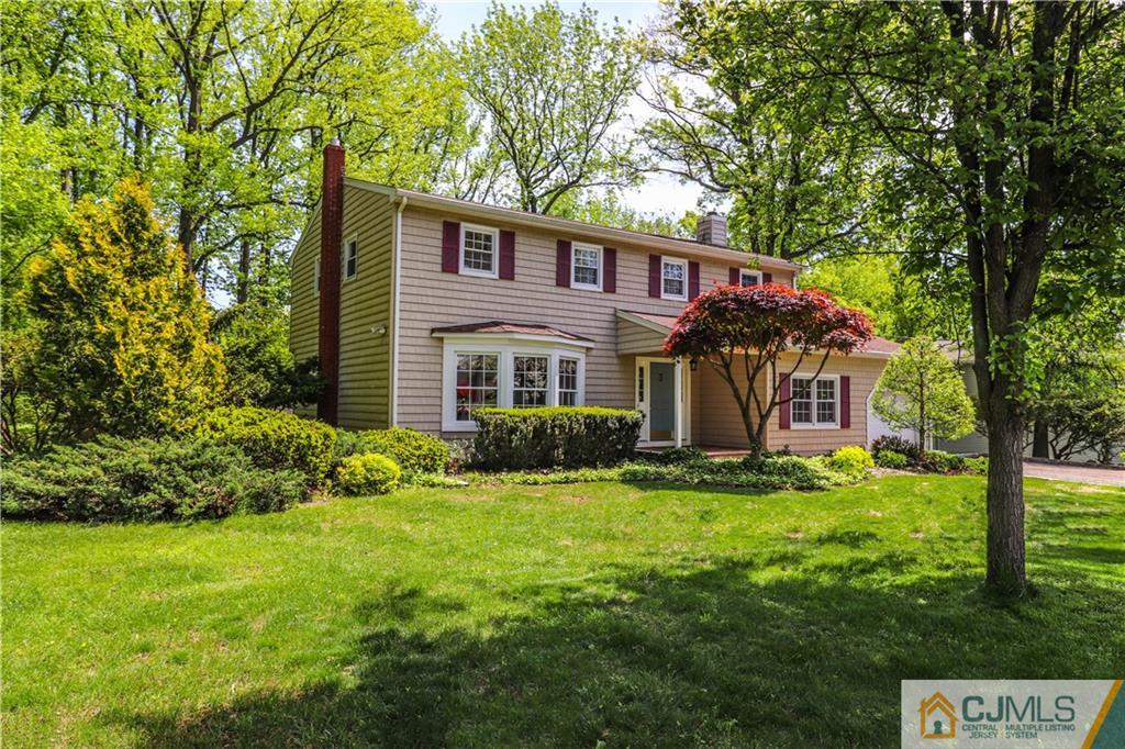 31 Sherwood Road Edison, NJ 08820 - Photo 1 of 25 a front view of a house with a yard and trees