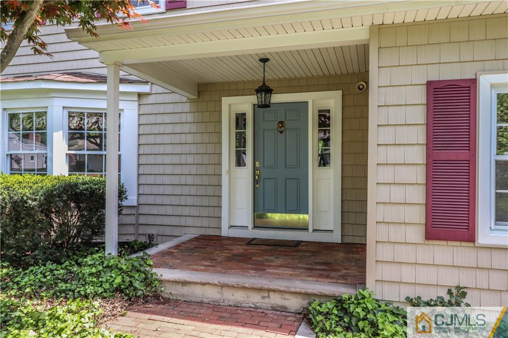 31 Sherwood Road Edison, NJ 08820 - Photo 3 of 25 a front view of a house with a garden