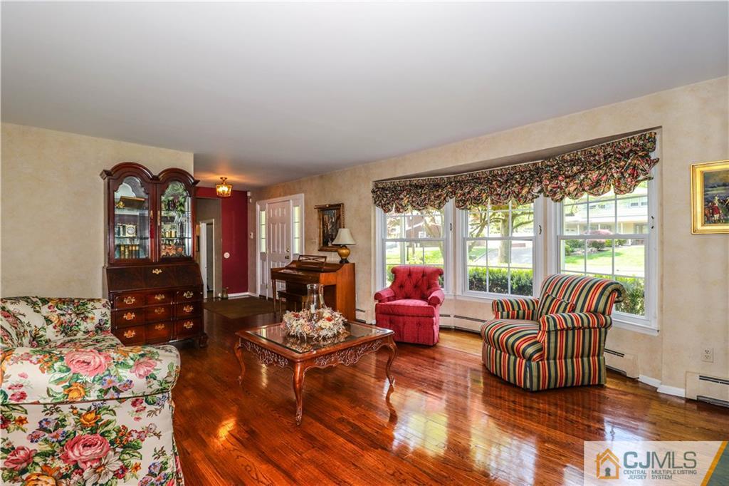 31 Sherwood Road Edison, NJ 08820 - Photo 4 of 25 a living room with furniture and a floor to ceiling window
