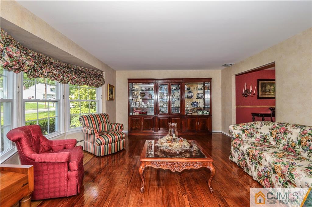 31 Sherwood Road Edison, NJ 08820 - Photo 5 of 25 a living room with furniture and floor to ceiling windows