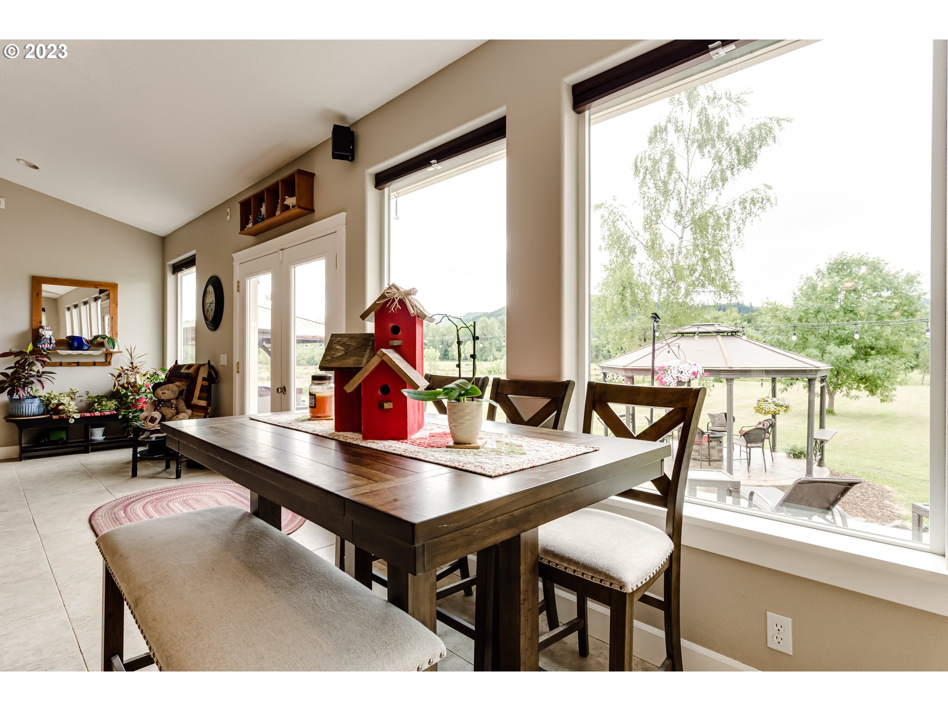 91819 Marcola Road Springfield, OR 97478 - Photo 17 of 48 a view of a dining room with furniture and a large window