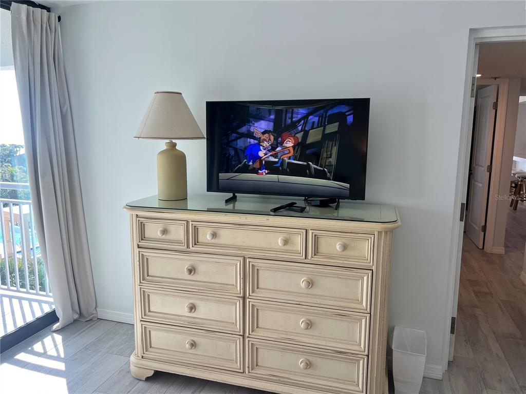 1001 Point Of Rocks Road, Unit 611 Sarasota, FL 34242 - Photo 11 of 39 a living room with flat screen tv