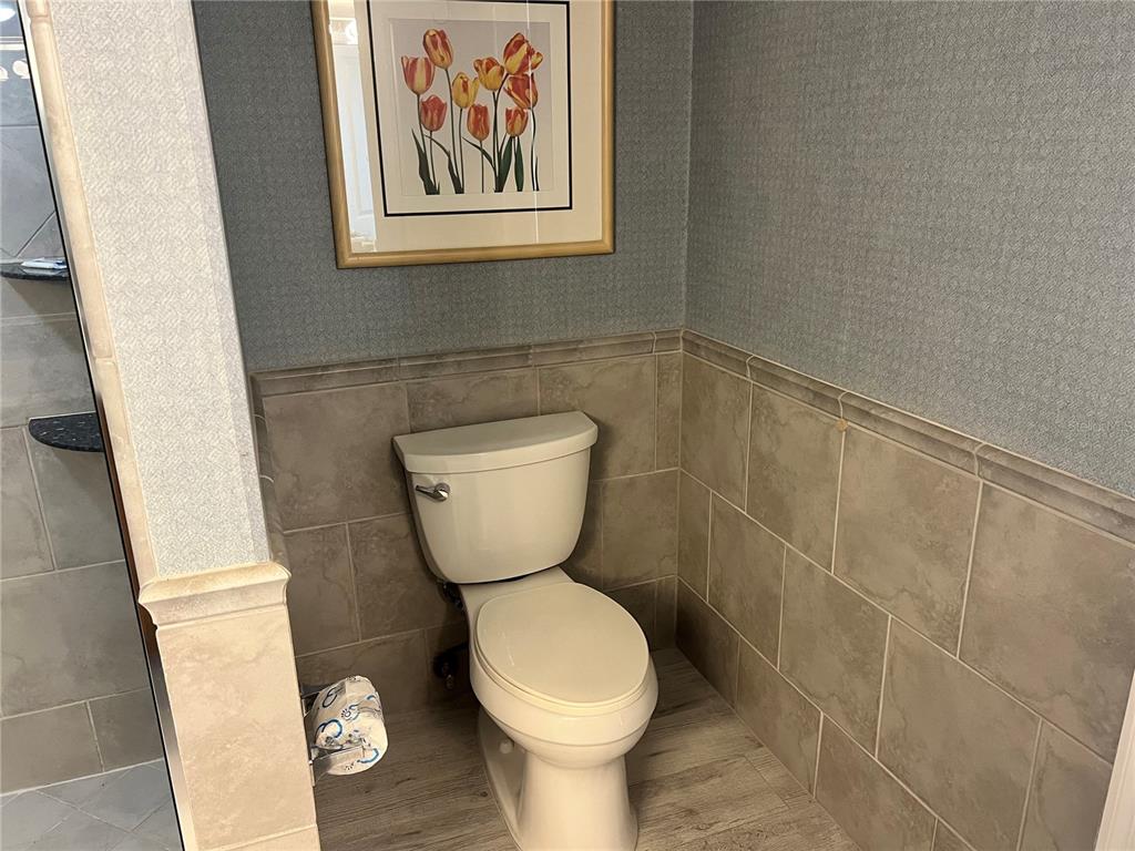 1001 Point Of Rocks Road, Unit 611 Sarasota, FL 34242 - Photo 17 of 39 a bathroom with a toilet and a sink