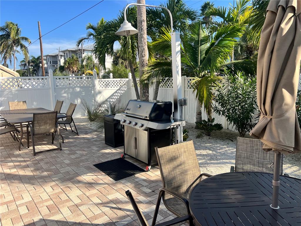 1001 Point Of Rocks Road, Unit 611 Sarasota, FL 34242 - Photo 29 of 39 a view of outdoor kitchen with seating area