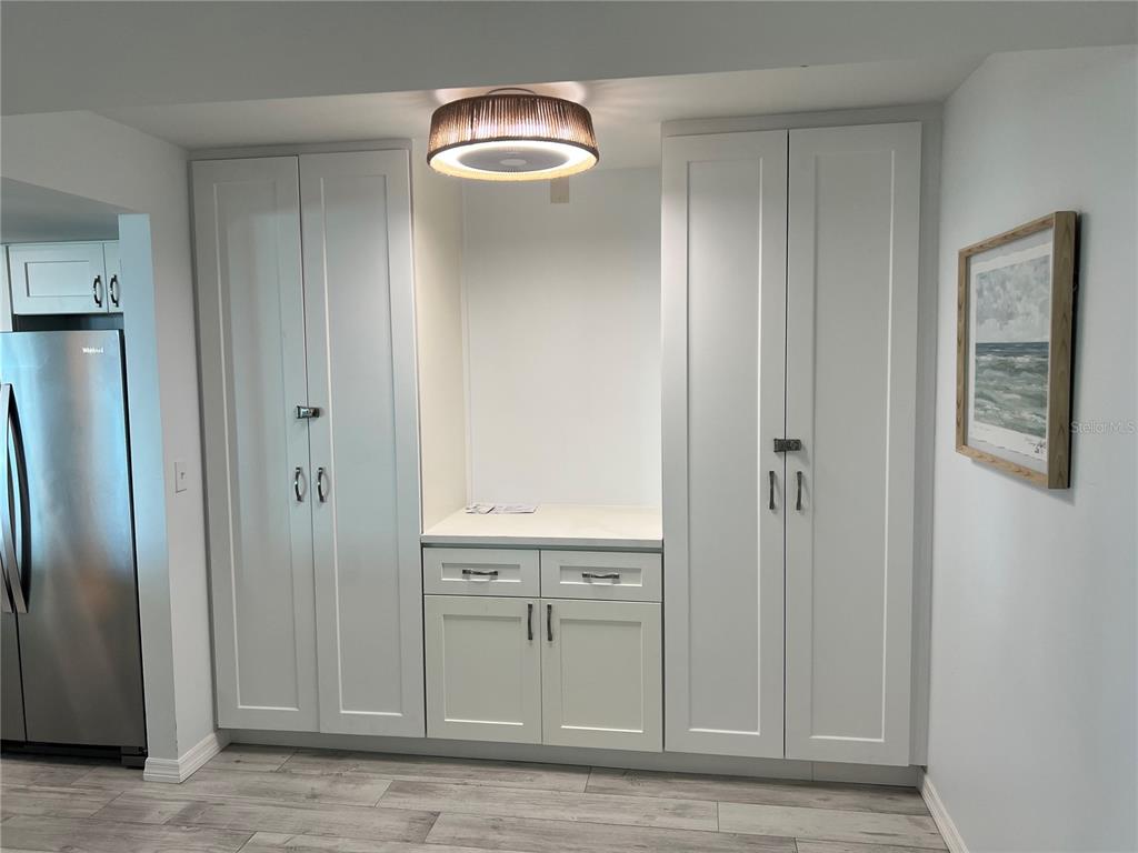 1001 Point Of Rocks Road, Unit 611 Sarasota, FL 34242 - Photo 5 of 39 a view of an empty room with wooden floor