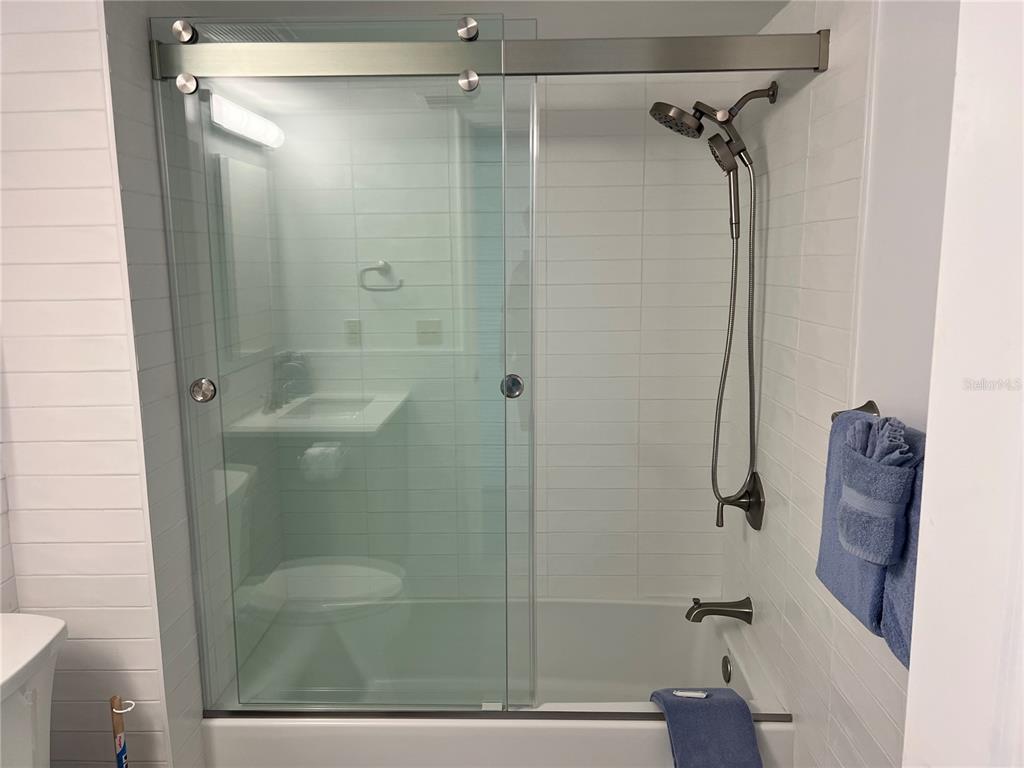 1001 Point Of Rocks Road, Unit 611 Sarasota, FL 34242 - Photo 9 of 39 a bathroom with a shower