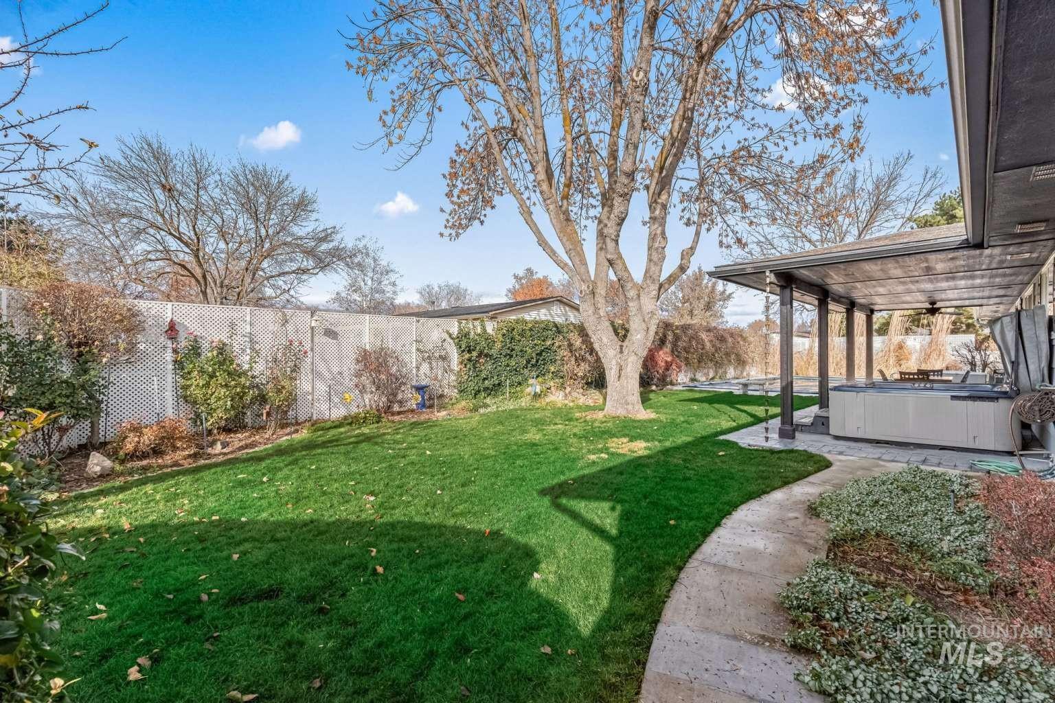 8720 Cornwall Drive Boise, ID 83704 - Photo 24 of 24 Fenced backyard featuring a hot tub and a patio
