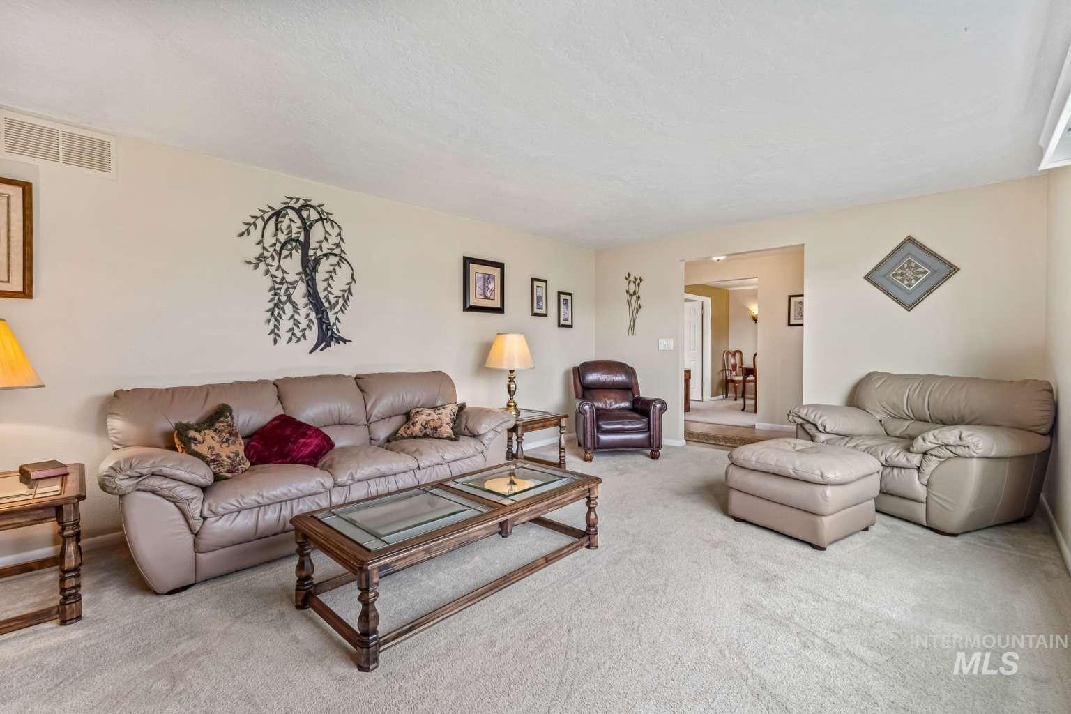 8720 Cornwall Drive Boise, ID 83704 - Photo 5 of 24 Living area with carpet flooring and baseboards