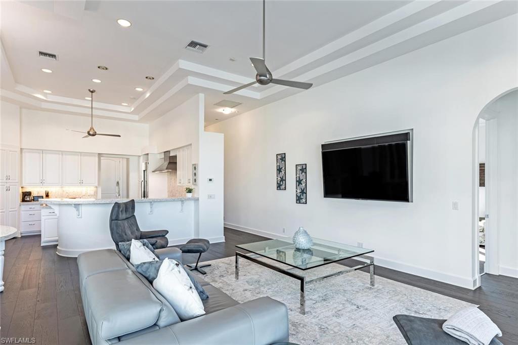 2540 Half Moon Walk Naples, FL 34102 - Photo 18 of 35 a living room with furniture and a flat screen tv