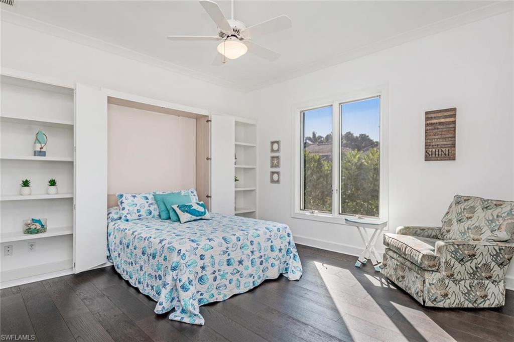 2540 Half Moon Walk Naples, FL 34102 - Photo 24 of 35 a living room with furniture and a window