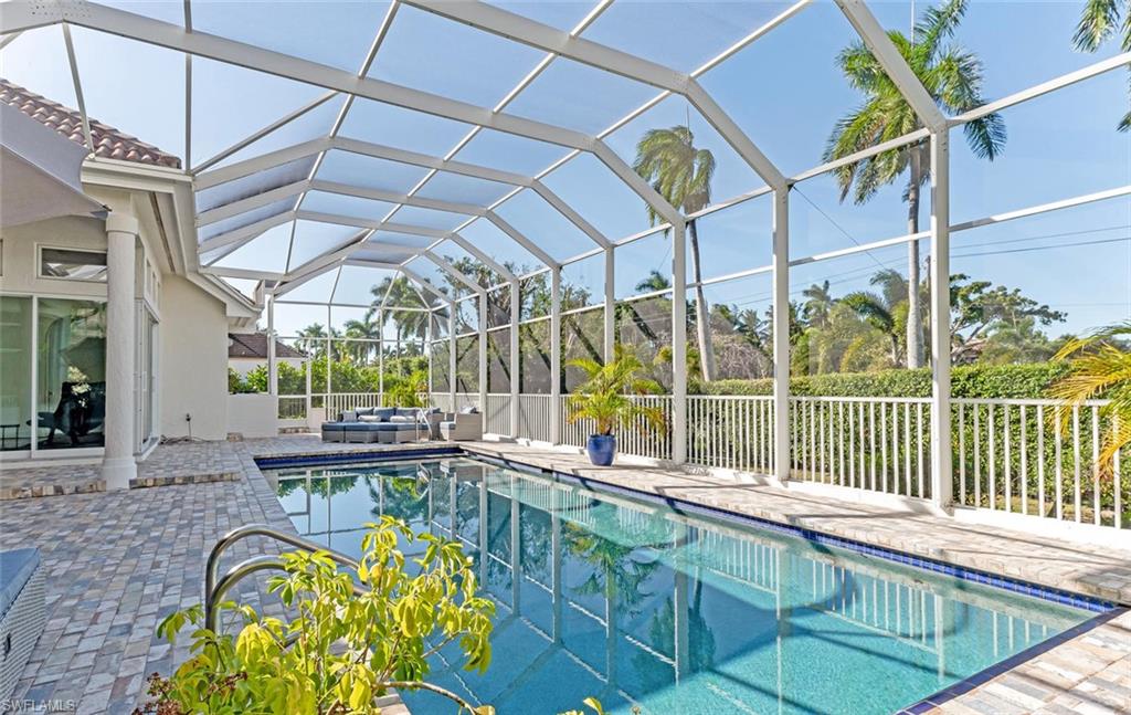 2540 Half Moon Walk Naples, FL 34102 - Photo 34 of 35 a view of a swimming pool with a porch