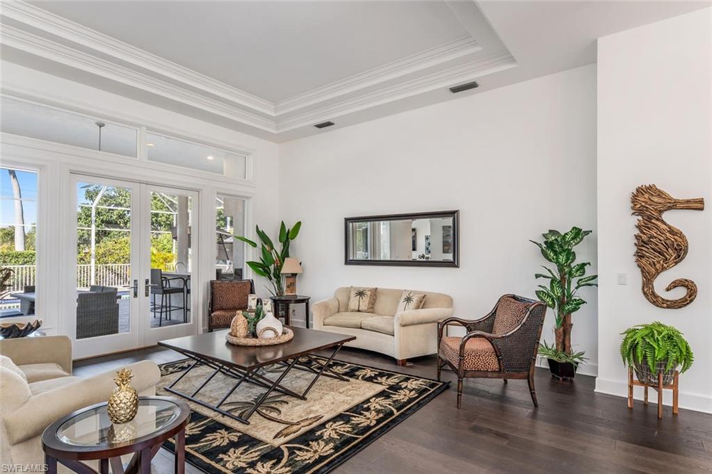 2540 Half Moon Walk Naples, FL 34102 - Photo 7 of 35 a living room with furniture potted plant and a window