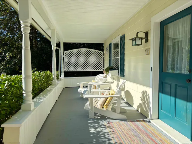 a view of balcony with furniture