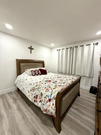 a bedroom with a bed and walk in closet