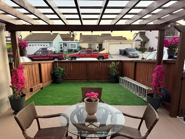 a view of a chairs and tables in patio