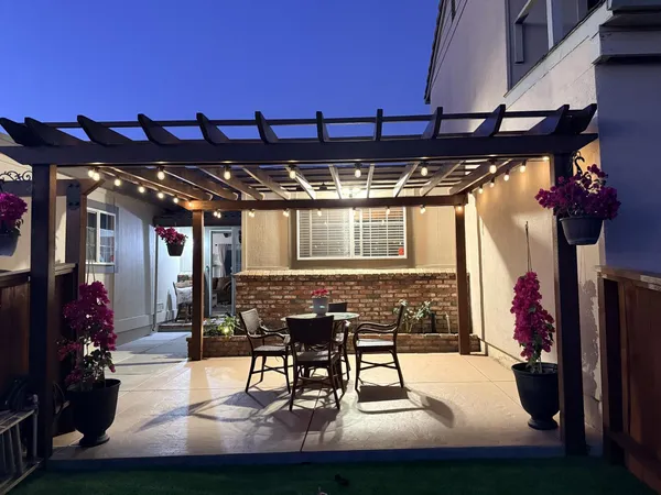 a view of a chairs and tables in a patio