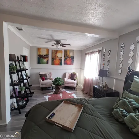 a living room with furniture or couch and a bookshelf