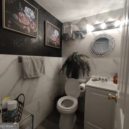 a bathroom with a toilet and a sink