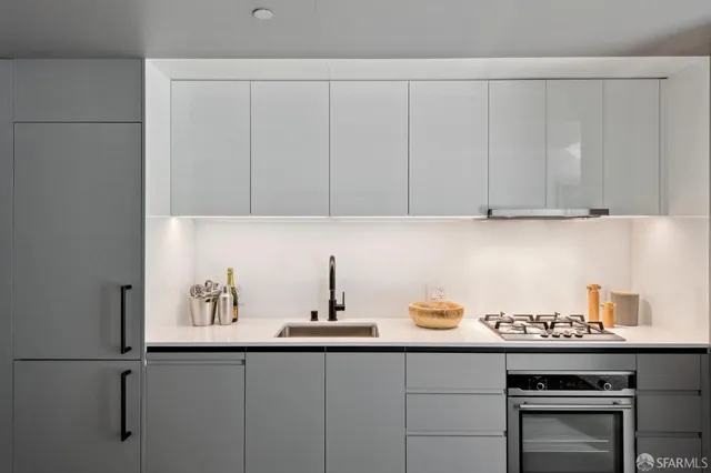 a kitchen with a sink and cabinets