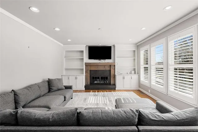 a living room with furniture window and a fireplace