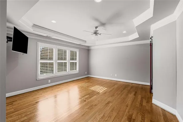 a bathroom with a granite countertop sink a toilet a mirror and shower