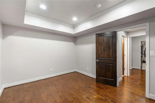 a view of a balcony with wooden floor