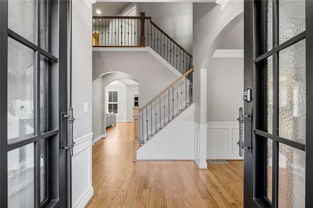 a view of entryway and hall with wooden floor
