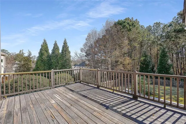 a view of a house with pool and chairs