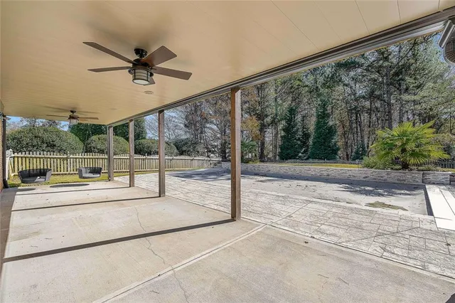 a view of a bench in a sidewalk next to a road