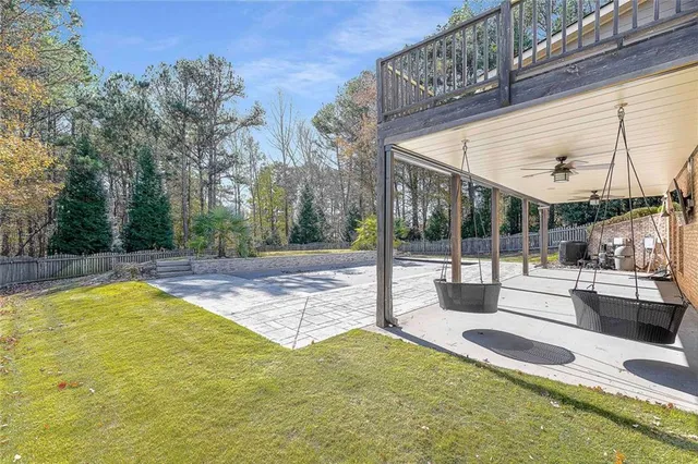 an aerial view of a house with yard swimming pool and outdoor seating