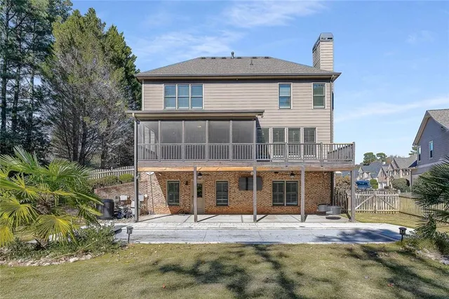 an aerial view of residential house with outdoor space and swimming pool