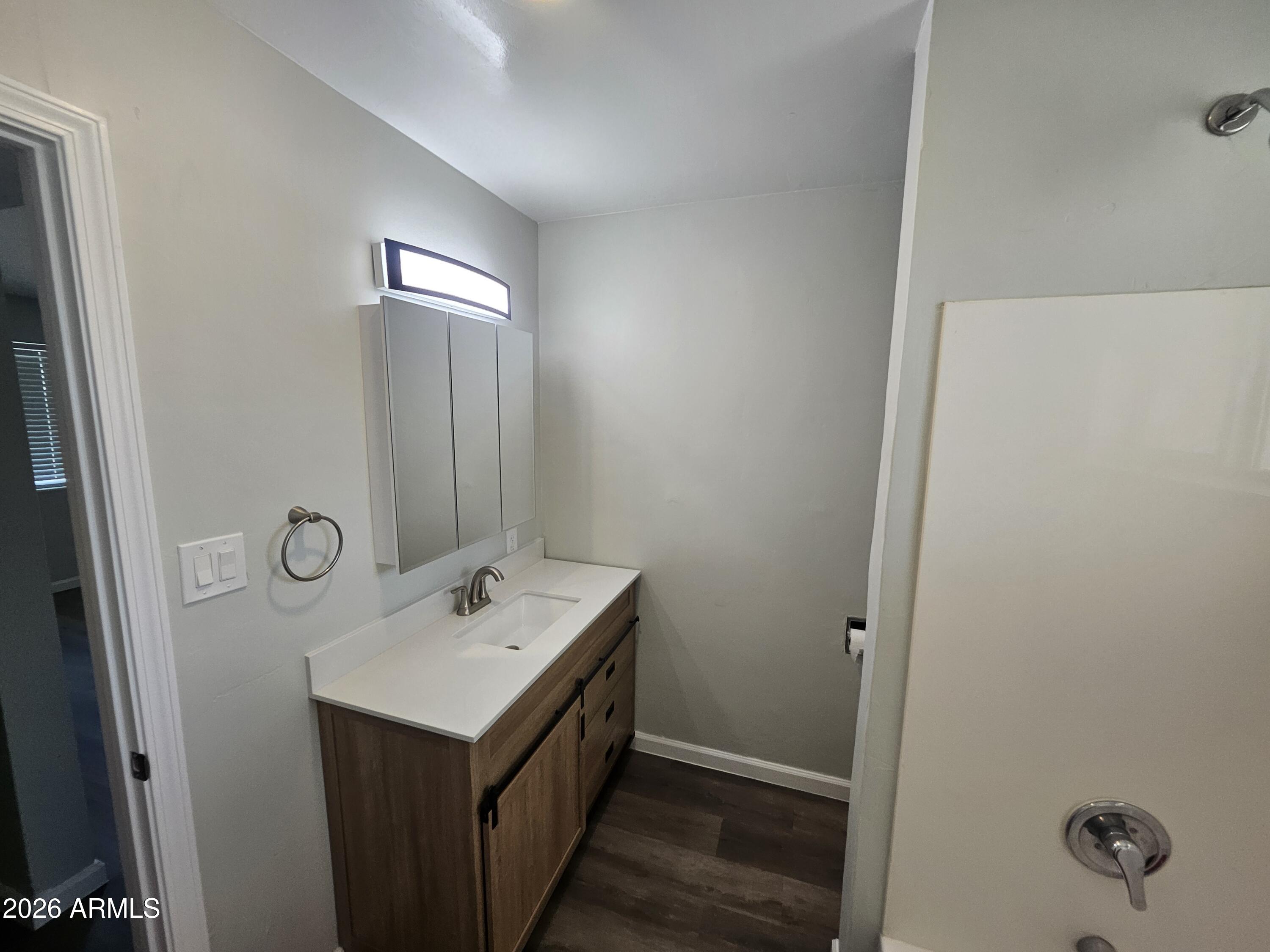524 West 3rd Place Mesa, AZ 85201 - Photo 16 of 23 a bathroom with a sink a vanity and a mirror