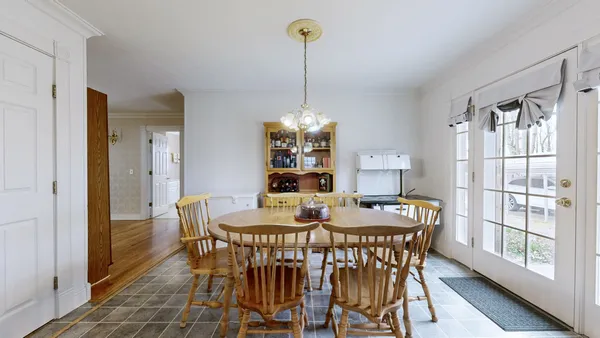 a bedroom with furniture and a wooden floor