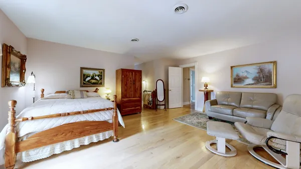 a view of a workspace with furniture and gym equipment