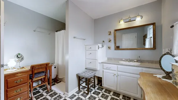 a view of a yard with snow on the road