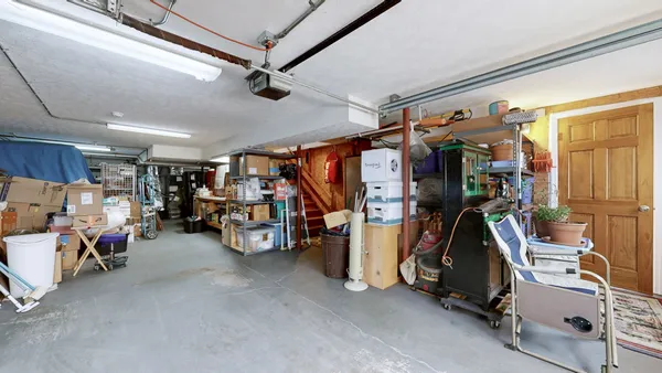 a view of parking garage with cars