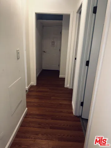 an empty room with wooden floor